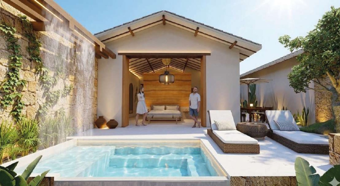 Suite con piscina privada, cascada en el muro de piedra y tumbonas